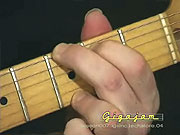 Playing the chord of G.