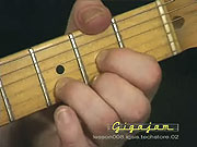 Playing the chord of D.